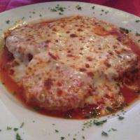 Eggplant Parmigiana · Eggplant topped with our homemade marinara sauce and baked mozzarella cheese.