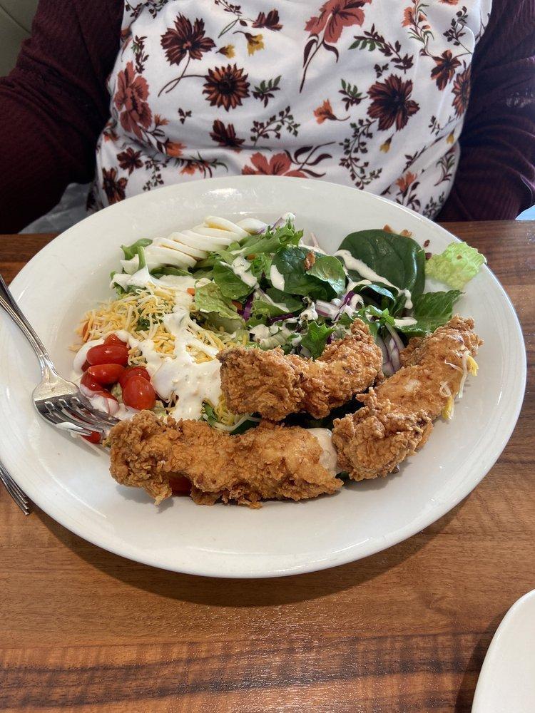 Crispy Chicken Salad · Mixed greens topped with breaded chicken tenders, bacon, tomatoes, red onions, hard-boiled egg and jack and cheddar cheeses. Served with your choice of dressing.