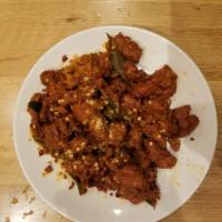 Guntur Chicken · Chicken cubes sauteed with dry red chillies and curry leaves. Spicy.