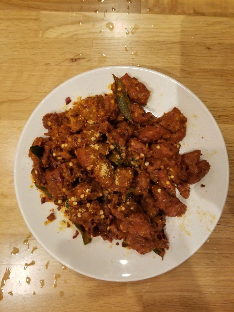 Guntur Chicken · Chicken cubes sauteed with dry red chillies and curry leaves. Spicy.