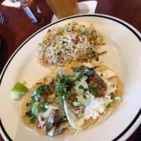Fish Tacos · Cajun seared haddock, cabbage, cole slaw, red onion, red pepper, scallions, avocado crema, c...