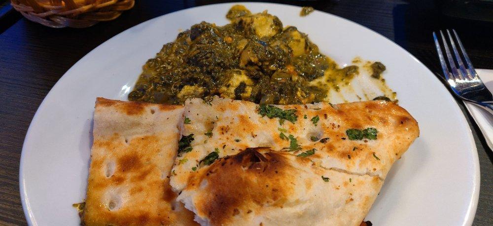 Palak Paneer · Spinach cooked with mild creamy sauce and topped with sauteed cheese cubes.