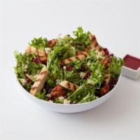 Chicken Gorgonzola Salad · Grilled chicken breast over fresh greens topped with sharp Gorgonzola cheese, craisins, hone...