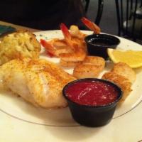 Seafood Platter · New Zealand roughy, lump crab cake, gulf shrimp and scallops (broiled). Served with choice o...
