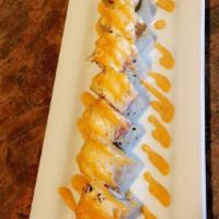 King Kong Roll · Spicy tuna, crab meat, tempura shrimp, and cucumber with albacore, eel, tuna and onion sauce.