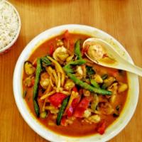 Red Curry · Medium spicy. Bamboo shoot, bell pepper, green bean, basil, lime leaf, and coconut milk.