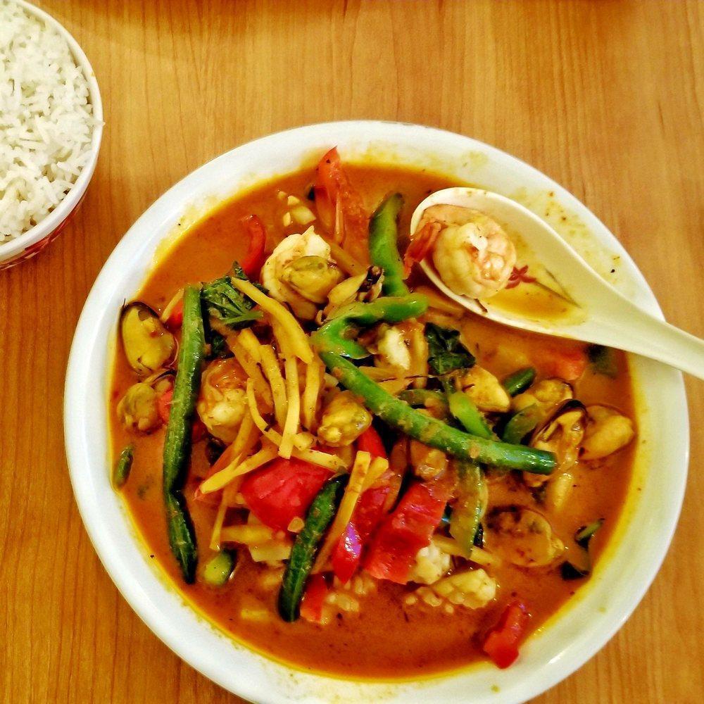 Red Curry · Medium spicy. Bamboo shoot, bell pepper, green bean, basil, lime leaf, and coconut milk.