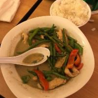 Green Curry · Medium spicy. Peas, bell pepper, green bean, basil, lime leaves and coconut milk.