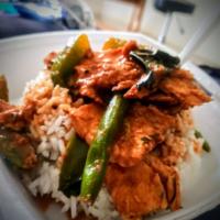 Panang Curry · Medium spicy. Green bean, bell pepper, basil, lime leaf, and coconut milk served over shredd...