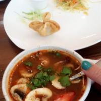 Tom Yum Soup · The famous Thai hot and sour soup with chopped tomato, red onion, lemongrass, lime leafs, mu...