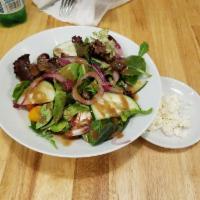Greek Salad · Feta cheese, heirloom tomatoes, red onion, olives, basil and vinaigrette.