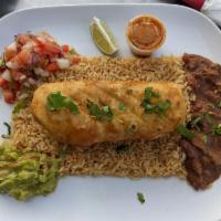 Pulled Beef Chimichanga · Rice, refried beans, pico de gallo, guacamole and sour cream.