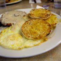 Chicken Fried Steak · Smothered in country gravy and served with 3 large eggs. Served with freshly grated hash bro...