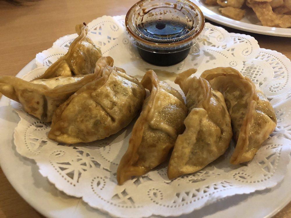 Pot Stickers · Pan fried dumplings filled with pork and cabbage.