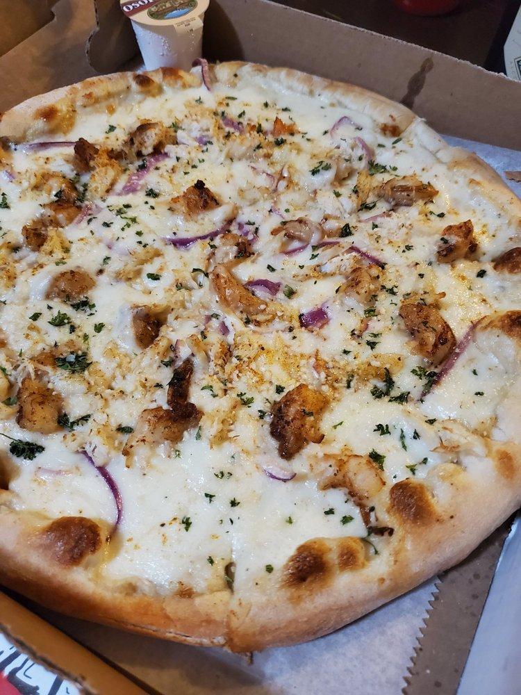 Seafood Alfredo Pizza · Sauteed shrimp, crab meat onions and diced tomatoes in our Old Bay spiced Alfredo sauce, topped with our special blend of 100% fresh natural cheeses. 

