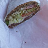Baked Leo Sandwich · Turkey, roast beef, Swiss cheese, garlic mayo, jalapeno spread, lettuce, tomato and onion on...