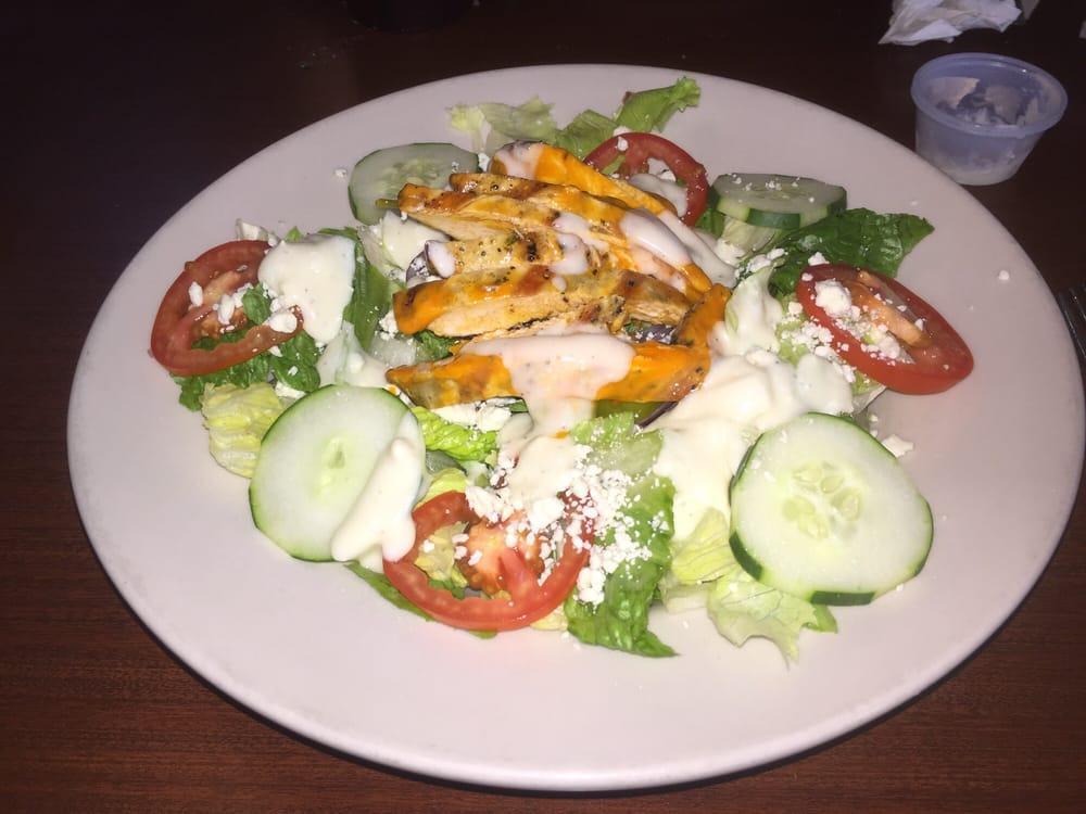 Buffalo Chicken Salad · Fresh greens, tomatoes, cucumbers, pepperoncini and red onions.  Topped with grilled buffalo chicken and gorgonzola.  Your choice of blue cheese or ranch dressing.
