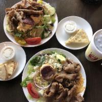 Gyro Platter · Gyro meat served over rice with Greek salad.