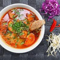 Bun Rieu Spicy Crab and Pork Soup · Crab and pork, tofu, vermicelli noodles, tomatoes, yellow onions, scallions, shrimp paste, e...