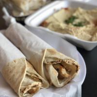 Chicken Shawarma · Thinly sliced roasted meat.rice soup and salad bread and garlic 