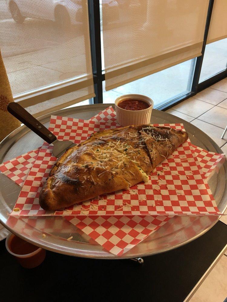 Calzone · Mozzarella, ricotta cheese and 2 toppings. 