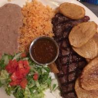 Mexican Steak · New York steak cook to order served with Mexican potatoes, rice, refried beans,onions, fresh...