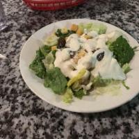 Caesar Salad · Romaine lettuce, croutons, Romano cheese and Caesar dressing.