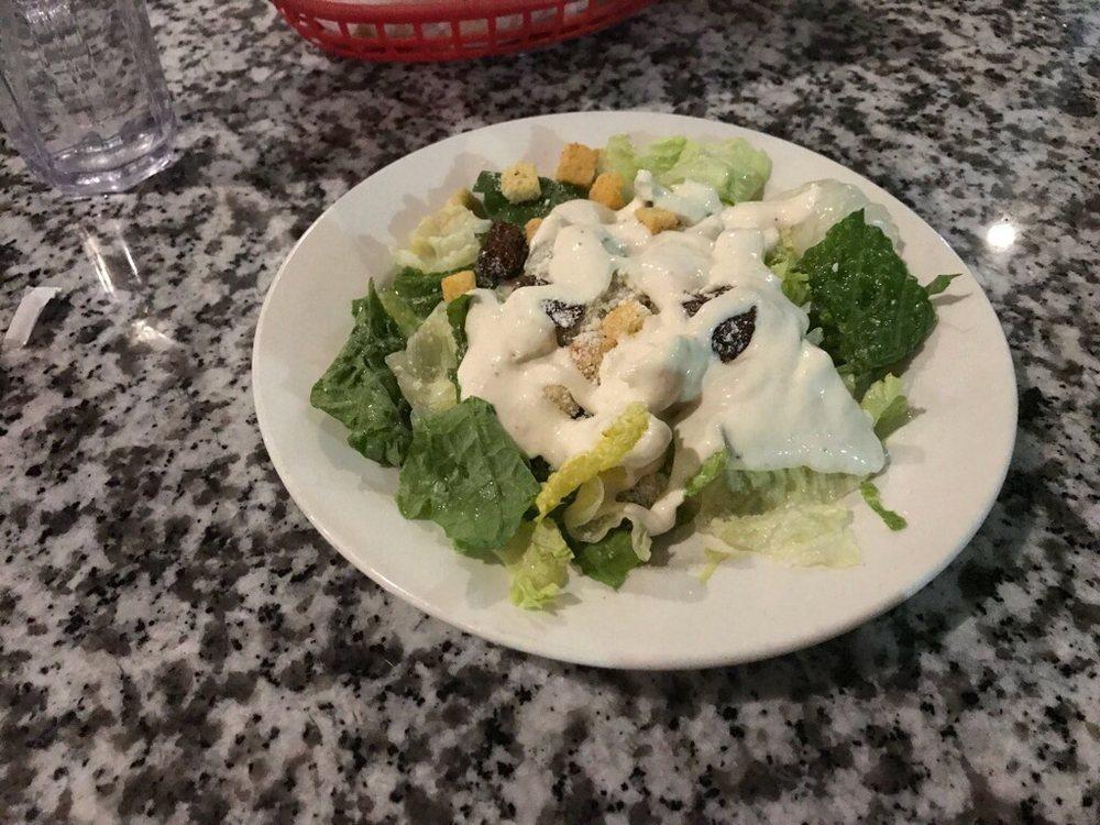 Caesar Salad · Romaine lettuce, croutons, Romano cheese and Caesar dressing.