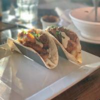 Fish Tacos · 2 tacos, marinated cod, cabbage, chipotle aioli, cilantro, avocado-lime crema, pico de gallo...