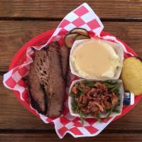 Brisket · Slow smoked overnight. Tender and juicy, sliced or chopped to your preference. (While suppli...