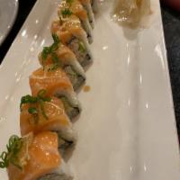 Sunshine Roll · Raw. Snow crab and avocado topped with salmon, lemon and ponzu sauce ans scallons