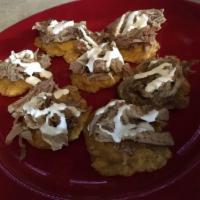 Tostones · Add cheese for an additional charge.