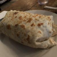 Burrito Gigante · Flour tortilla, rice, beans, lettuce, tomatoes, onions, cilantro, guacamole, cheese, and sou...