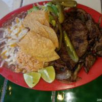 Carne Asada Combo Plate · Steak with grilled onions, salsa and salad. Served with rice and beans and corn tortillas.