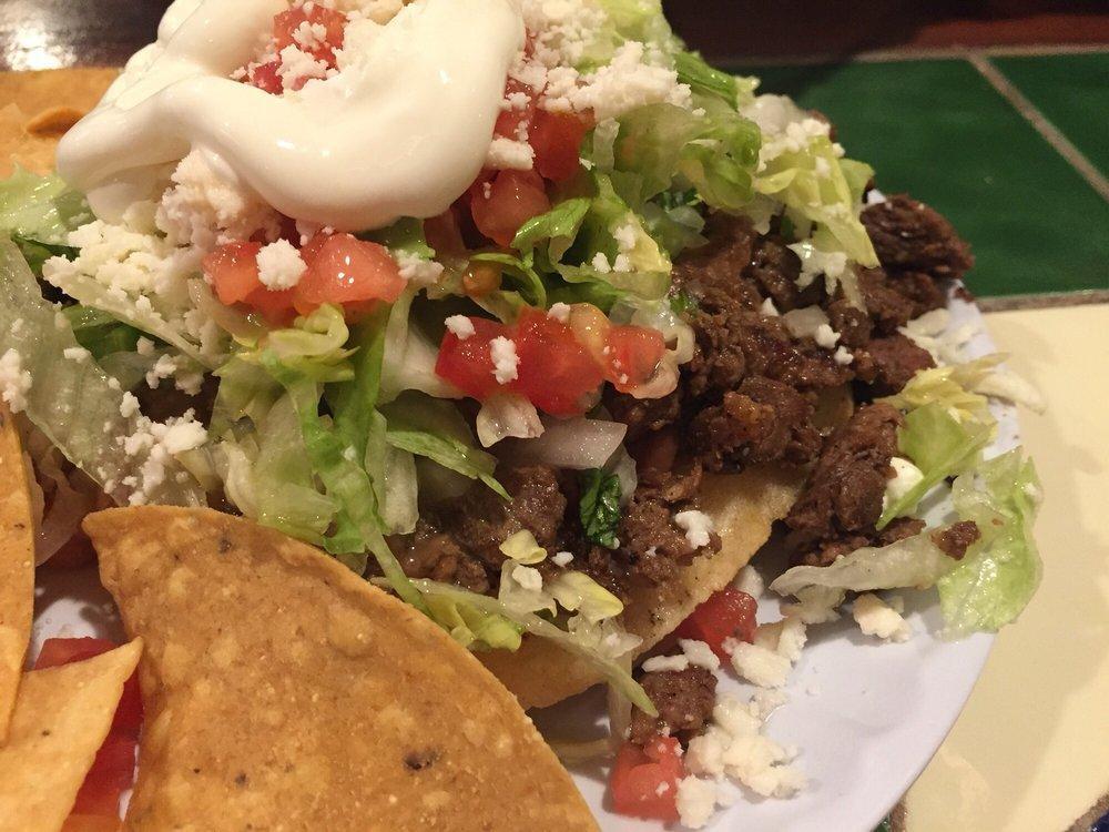 Sope · Handmade tortilla with beans, lettuce, tomato, onions, cilantro, ranchero cheese, sour cream, guacamole and hot salsa with your choice of meat.