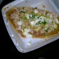 Huaraches · Open face dish of meat, beans, onions and cilantro served on a corn made base resembling the...