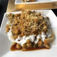 Papdi Chaat · A combination of crispy chips, chickpeas, onions and herbs seasoned in a spicy yogurt, mint ...