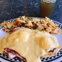 Classic Eggs Benedict · Canadian bacon and 2 poached eggs on an English muffin, topped with hollandaise sauce.