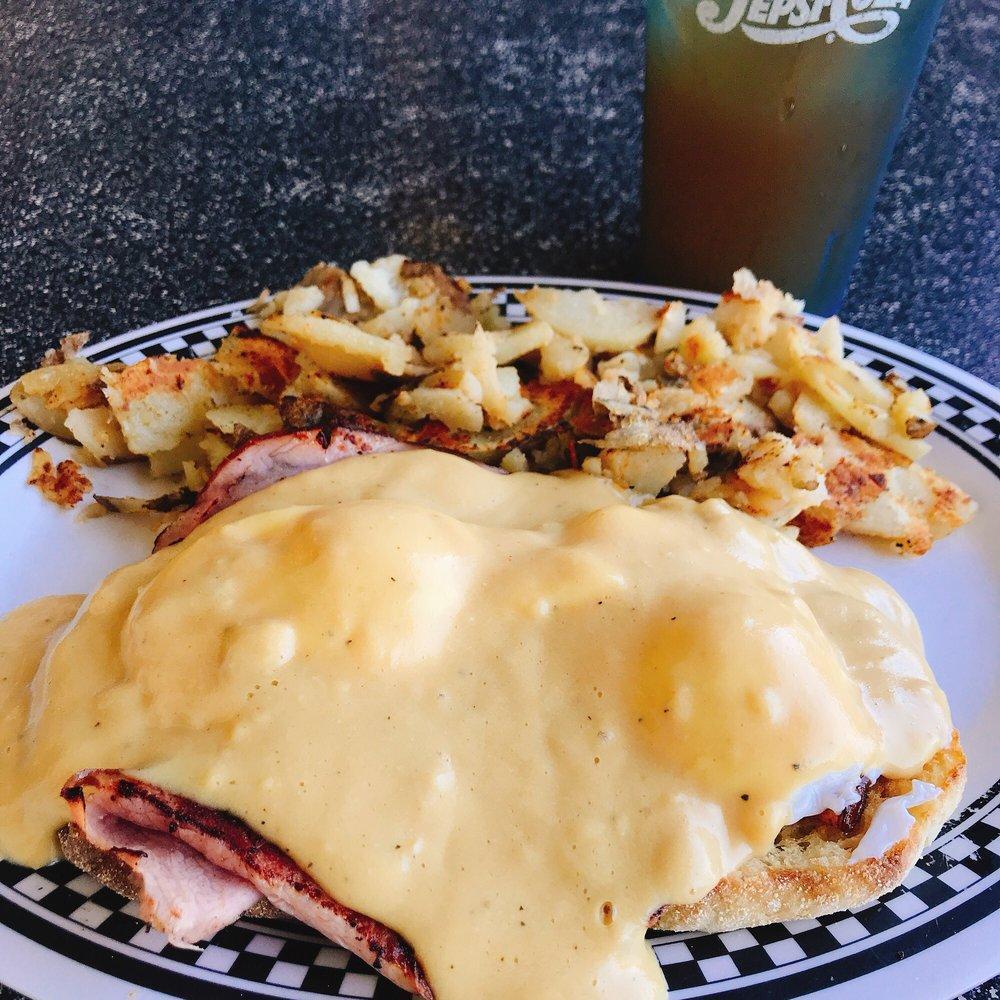 Classic Eggs Benedict · Canadian bacon and 2 poached eggs on an English muffin, topped with hollandaise sauce.