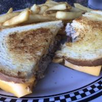 Tuna Melt Sandwich · Generous serving of our seasoned tuna with American cheese, sliced tomatoes on grilled sour ...