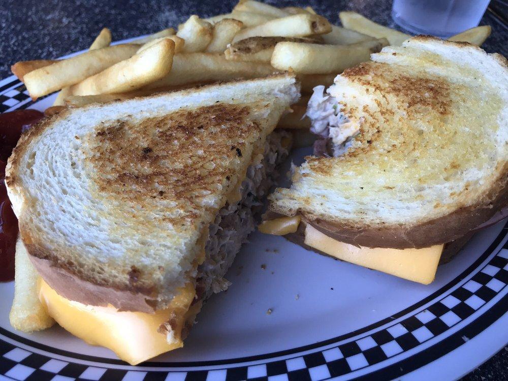 Tuna Melt Sandwich · Generous serving of our seasoned tuna with American cheese, sliced tomatoes on grilled sour dough.