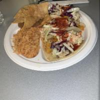 Pinche Combination Plate · Any 3 tacos plus rice, beans and chips.