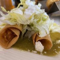 Chicken Flautas · Three deep fried taquitos filled with shredded chicken breast, coated in chile verde, and to...