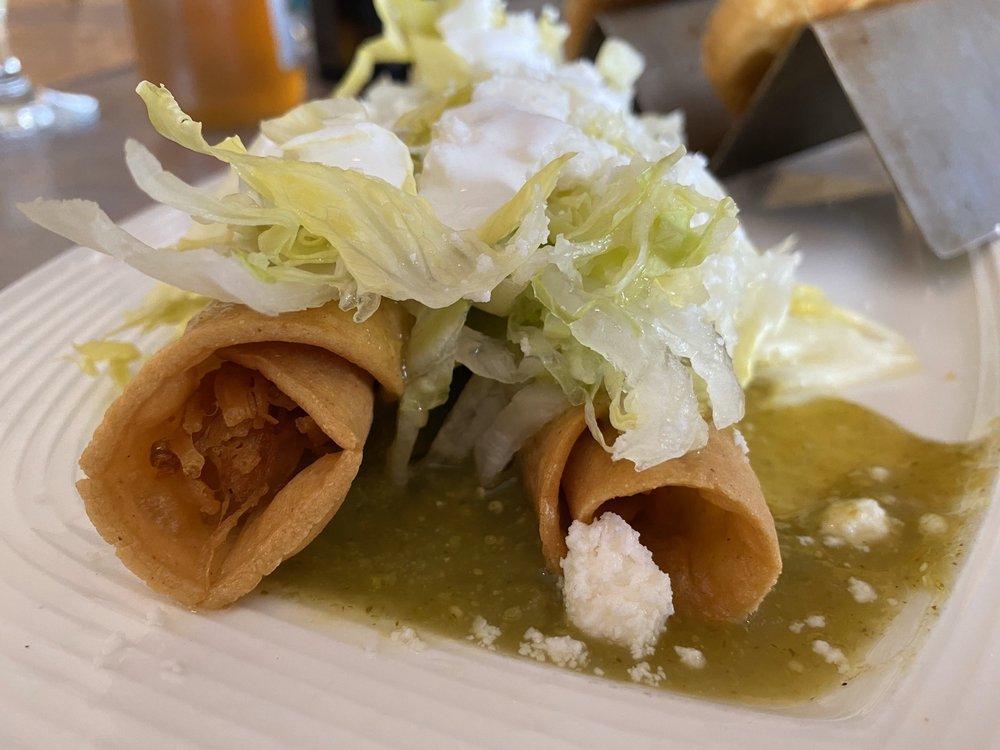 Chicken Flautas · Three deep fried taquitos filled with shredded chicken breast, coated in chile verde, and topped with lettuce, sour cream, and queso fresco.

Served with a side of Mexican rice and beans.