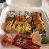 Lion King Roll · Comes with crab meat, avocado, cucumber, salmon, spicy mayo and unagi sauce on top. All bake...
