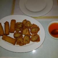 4 Piece Crispy Spring Rolls · Traditionally fried eggless vegetable filled rolls.