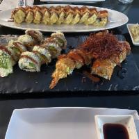 Heart Attack Tempura Sumo Special · Raw. Spicy tuna, spicy crab, avocado, cream cheese, and jalapeno topped with sweet, and spic...