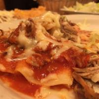 Enchiladas Rancheras · 2 cheese enchiladas topped with pork cooked with tomatoes, onions, bell peppers and enchilad...