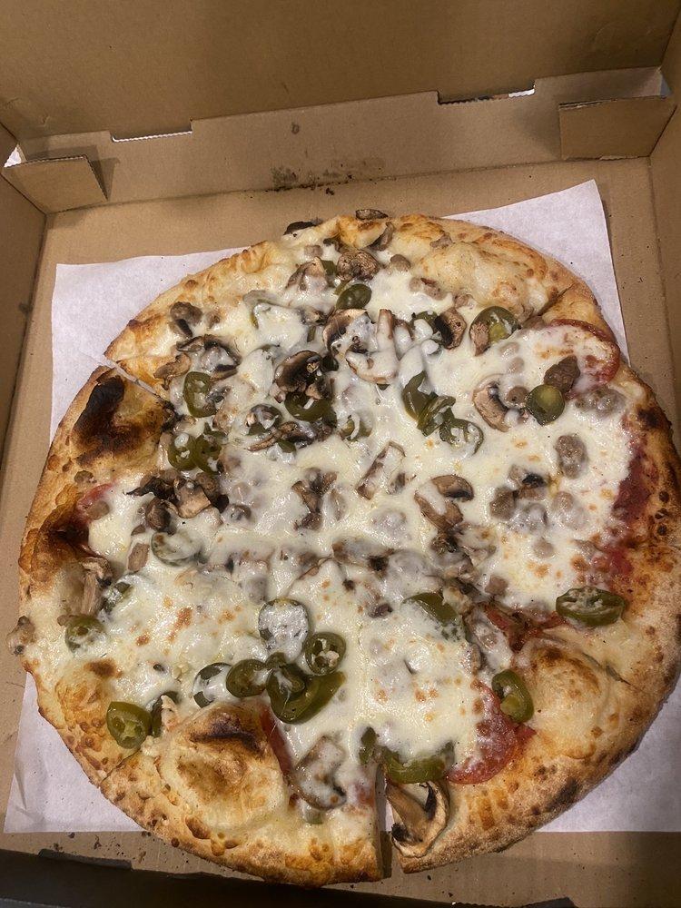 Bronx Bomber Pizza · Pepperoni, Italian sausage, mushrooms, jalapeños, fresh garlic, whole-milk mozzarella, house pizza sauce.