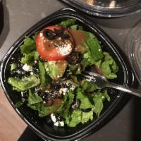 Greek Salad · Romaine lettuce, Roma tomatoes, feta, black olives, red onions, served with balsamic dressing.